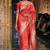 Orange silk blend printed saree with zari work