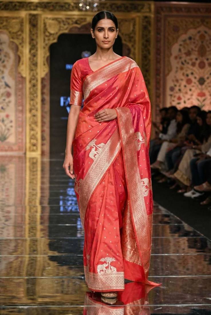 Orange silk blend printed saree with zari work