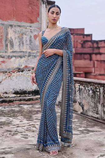 Teal georgette embroidered saree with mirror work