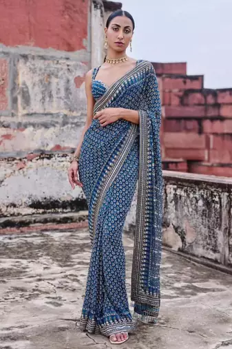 Teal georgette embroidered saree with mirror work