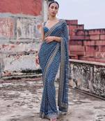 Teal georgette embroidered saree with mirror work
