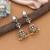 Light pink color american diamond earrings