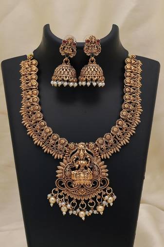 Elegant gold color lord laxmi temple necklace set with traditional ethnic design