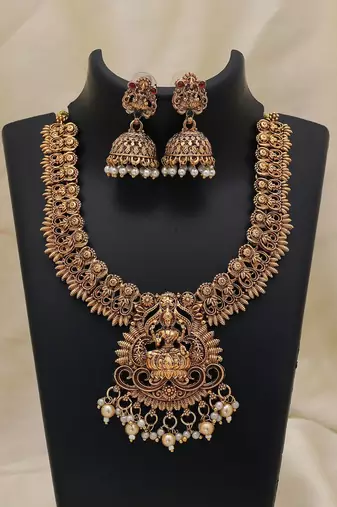 Elegant gold color lord laxmi temple necklace set with traditional ethnic design