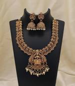 Elegant gold color lord laxmi temple necklace set with traditional ethnic design