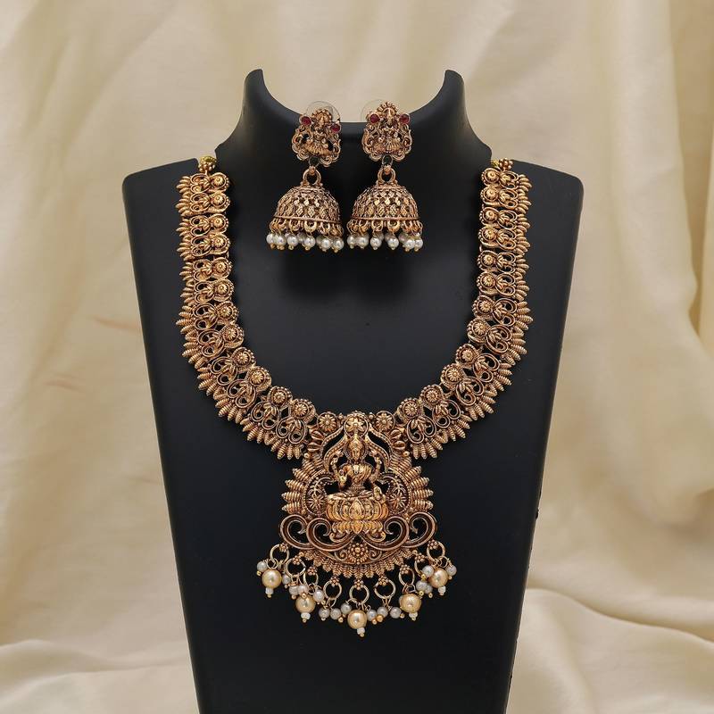 Elegant gold color lord laxmi temple necklace set with traditional ethnic design