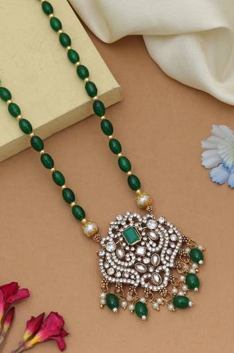 Stylish green color stone necklace with traditional ethnic party wear finish