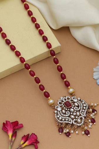 Graceful maroon color stone necklace elegant festive jewelry design collection