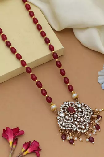 Graceful maroon color stone necklace elegant festive jewelry design collection