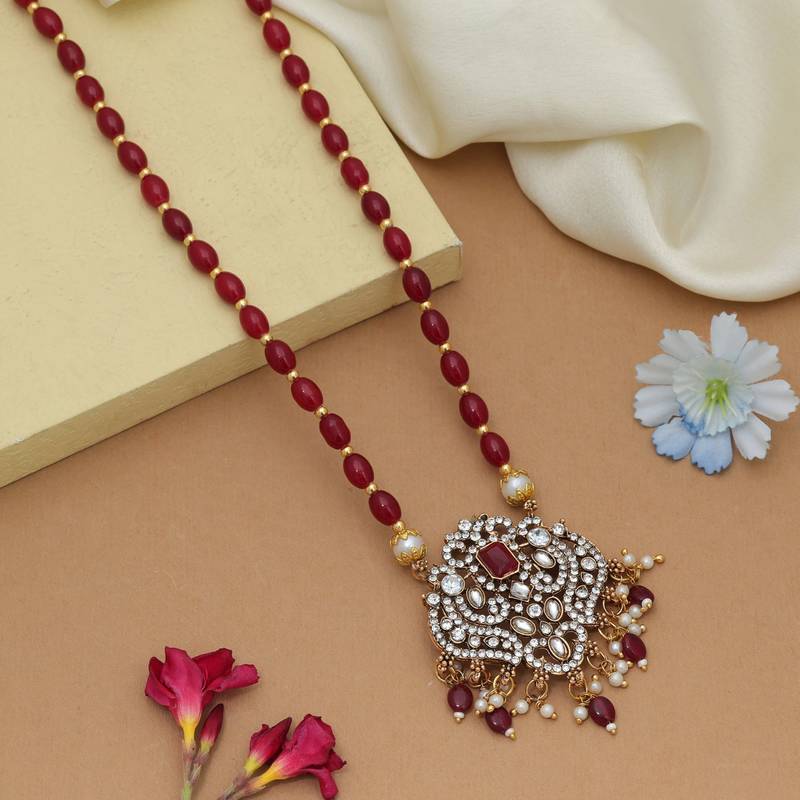Graceful maroon color stone necklace elegant festive jewelry design collection