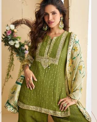 Green silk blend  embroidered sequin salwar suit  2