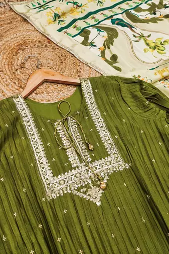 Green silk blend  embroidered sequin salwar suit 
