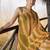 green & orange ruffled pre-stitched leheriya chiffon saree