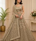 Golden Multi Thread Sequin Zari Embroidery Zircon Studded Net Lehenga Choli