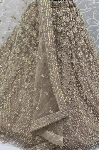 Golden Color Multi Thread Work,Sequence,Zari Embroidery,Zircon Studded All Over Work Net Lehenga Choli