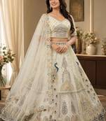 White Color Peacock Pattern Crafted,Dori And Thread Work,Zircon Diamond Studded All Over Work Net Lehenga Choli