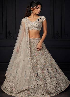 White Color Peacock Pattern Crafted,Dori And Thread Work,Zircon Diamond Studded All Over Work Net Lehenga Choli 1