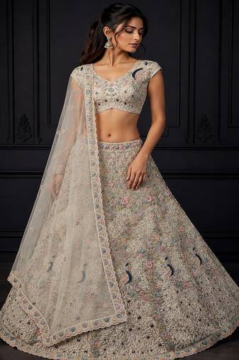 White Peacock Pattern Crafted Dori And Thread Zircon Studded Net Lehenga Choli