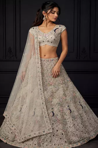White Peacock Pattern Crafted Dori And Thread Zircon Studded Net Lehenga Choli
