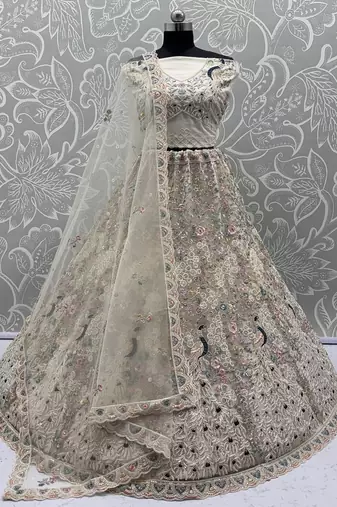 White Color Peacock Pattern Crafted,Dori And Thread Work,Zircon Diamond Studded All Over Work Net Lehenga Choli