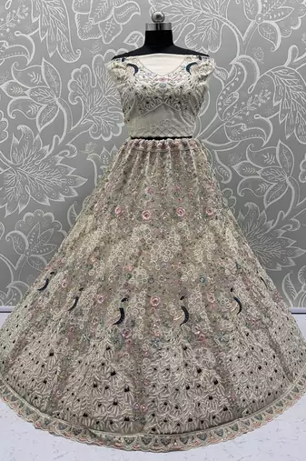 White Color Peacock Pattern Crafted,Dori And Thread Work,Zircon Diamond Studded All Over Work Net Lehenga Choli