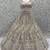 White Peacock Pattern Crafted Dori And Thread Zircon Studded Net Lehenga Choli