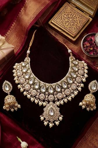 gold-plated kundan and pearl choker set with earrings