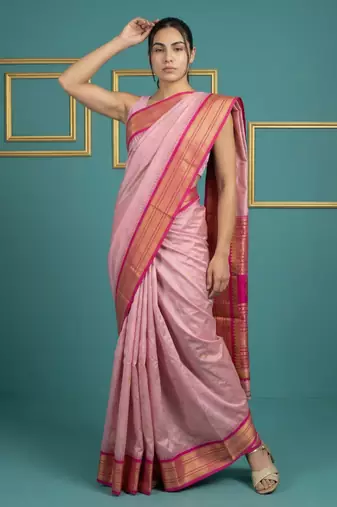 baby pink soft silk blend with gold zari motifs zari woven saree 