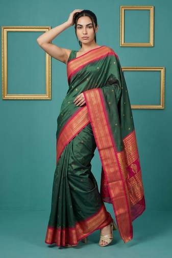 bottel green soft silk blend with gold zari motifs zari woven saree 