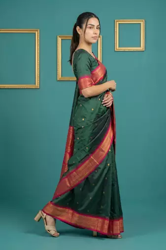 bottel green soft silk blend with gold zari motifs zari woven saree 
