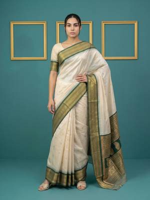 cream soft silk blend with gold zari motifs zari woven saree  1