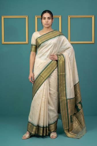 cream soft silk blend with gold zari motifs zari woven saree 