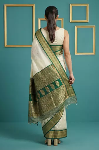 cream soft silk blend with gold zari motifs zari woven saree 