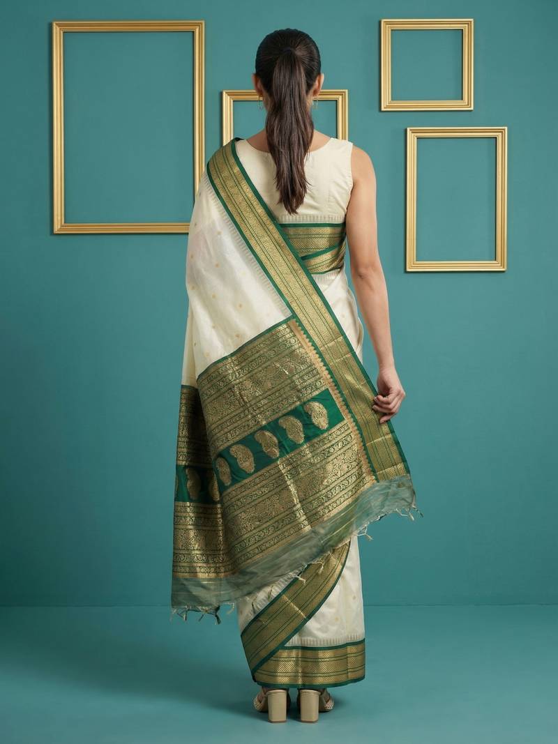 cream soft silk blend with gold zari motifs zari woven saree 