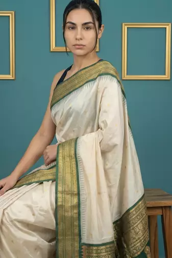 cream soft silk blend with gold zari motifs zari woven saree 