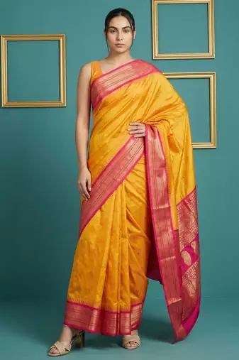 orange soft silk blend with gold zari motifs zari woven saree 