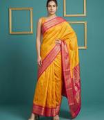 orange soft silk blend with gold zari motifs zari woven saree 