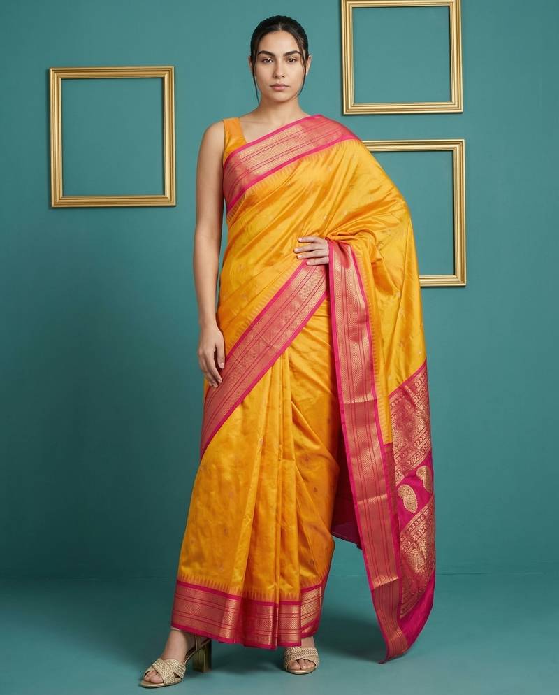 orange soft silk blend with gold zari motifs zari woven saree 