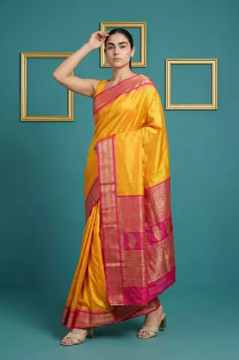 orange soft silk blend with gold zari motifs zari woven saree 