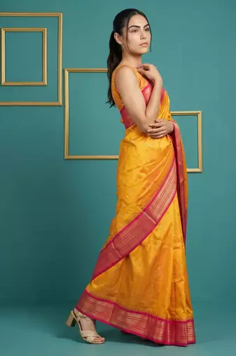 orange soft silk blend with gold zari motifs zari woven saree 