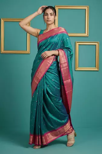 teal green soft silk blend with gold zari motifs zari woven saree 