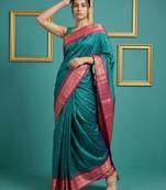 teal green soft silk blend with gold zari motifs zari woven saree 
