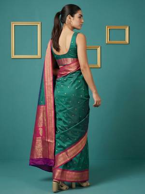 teal green soft silk blend with gold zari motifs zari woven saree  2