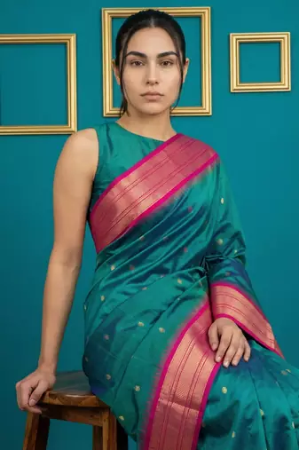 teal green soft silk blend with gold zari motifs zari woven saree 