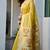 Yellow cotton jacquard woven with zari border & tassels saree with blouse