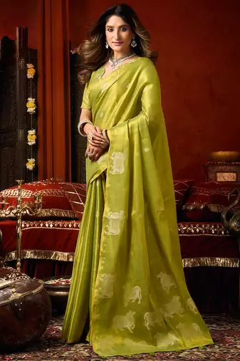 Parrot green heavy tissue allover cow woven butta with tassels saree with blouse
