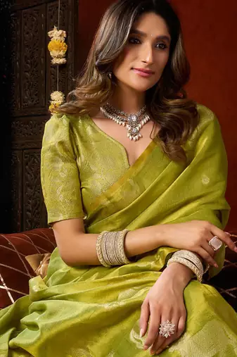 Parrot green heavy tissue allover cow woven butta with tassels saree with blouse