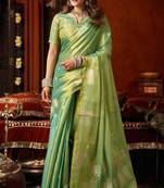 Sea green heavy tissue allover cow woven butta with tassels saree with blouse