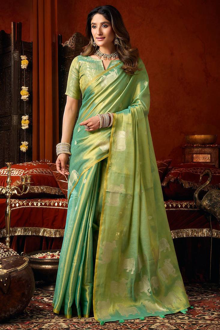 Sea green heavy tissue allover cow woven butta with tassels saree with blouse