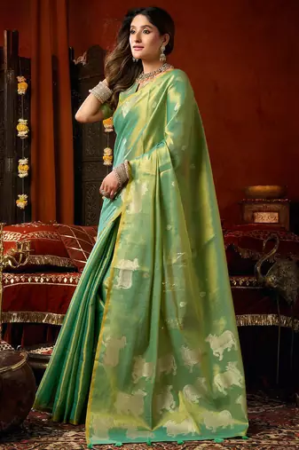 Sea green heavy tissue allover cow woven butta with tassels saree with blouse